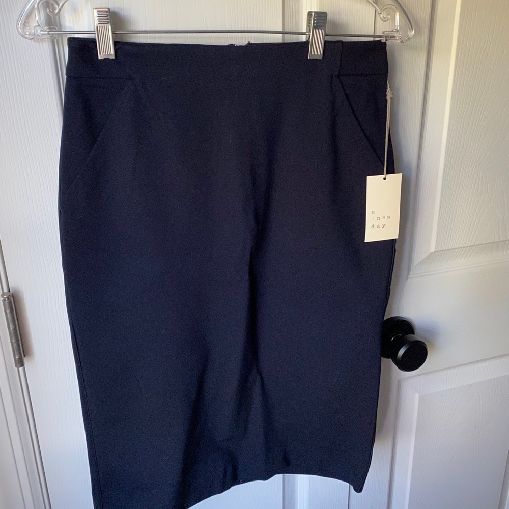 Brand new with tags pencil skirt. Navy. Pockets.